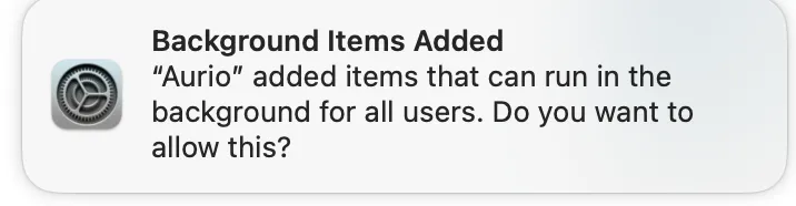The macOS notification reading “Background Items Added — Aurio added items that can run in the background for all users.”